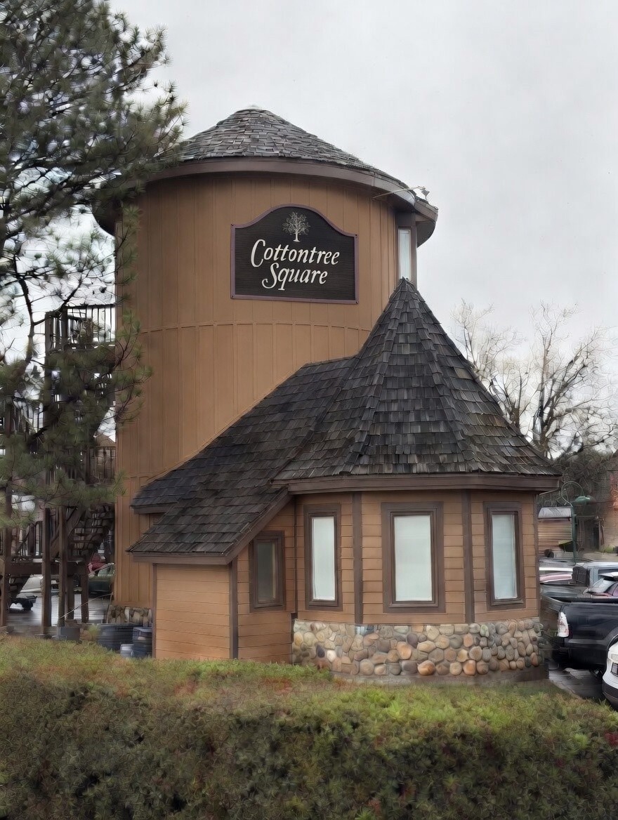 Signature tower building with Cottontree Square sign